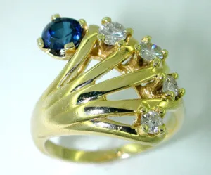 Hand Ring Set with Sapphire and Diamonds in 14 Karat Gold